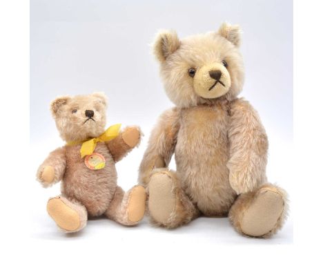 Steiff teddy bears, two post-war examples, c1960s/1950s, one with silver ear button and red/yellow tag, height 23cm; the othe