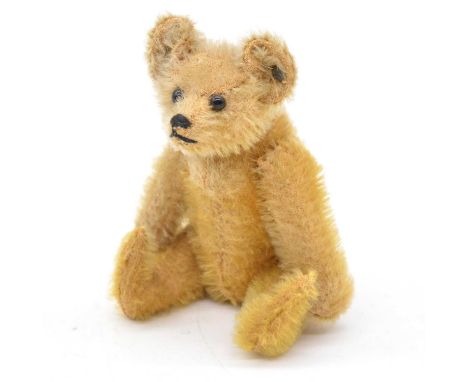 Small Steiff teddy bear, c1920, black button eyes, jointed limbs, button to ear, 14cm