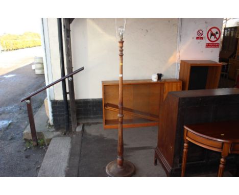 A mahogany turned standard lamp