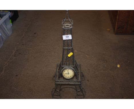 A decorative mantel clock in the form of The Eiffel tower 