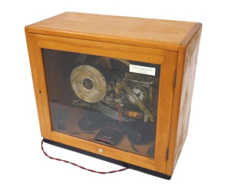 Gents of Leicester C69 programmer with bells and lights, within a light wooden glazed case, 16" high
