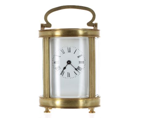 Carriage clock timepiece within an oval fluted pillared case, 6.5" high