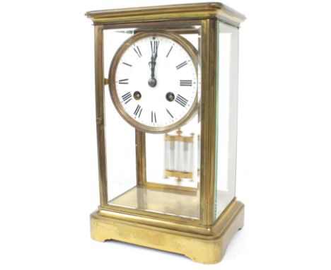 French brass four glass two train mantel clock striking on a bell, the 3.5" white dial within a bevelled glazed stepped case,