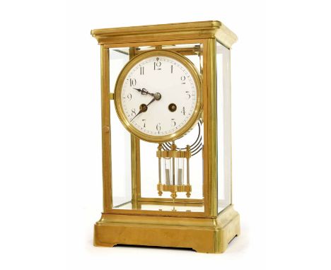 French brass four glass two train mantel clock striking on a gong, the 4" white dial over a mercury pendulum and within a ste