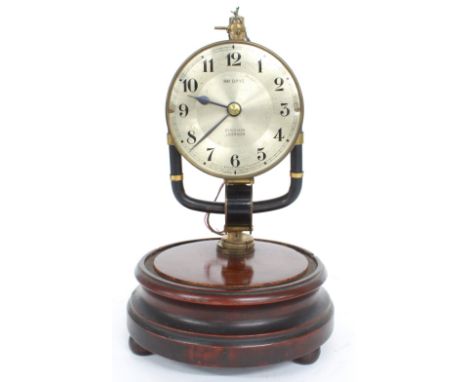 Electric mantel clock, the 3.5" silvered dial inscribed Pinchin Johnson, 800 Days, upon a circular stepped mahogany base, 9.5
