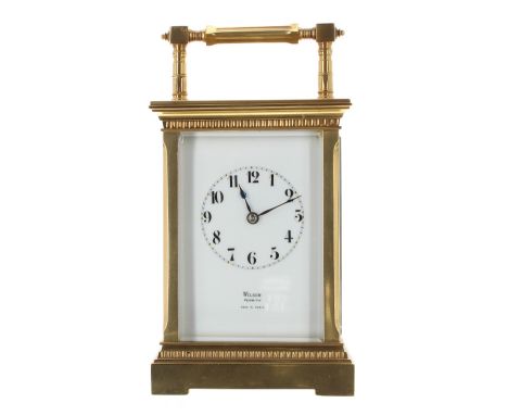 Carriage clock striking on a gong, the movement back plate stamped with the initials DH, the dial signed Wilson, Penrith, Mad