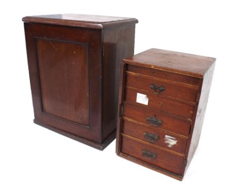 Early 20th century tool makers chest, the panelled door opening to reveal two short over four long drawers containing various