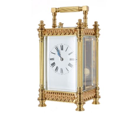 Repeater carriage clock striking on a gong, the back plate stamped no. 6551, within an ornate fluted pillared case with appli