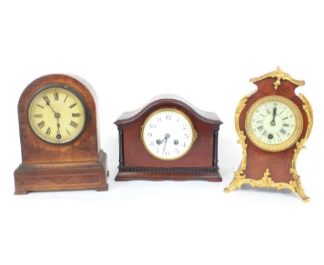 French mahogany two train mantel clock striking on a gong, the 4" white dial within a rounded arched case, 7.25" high; also a