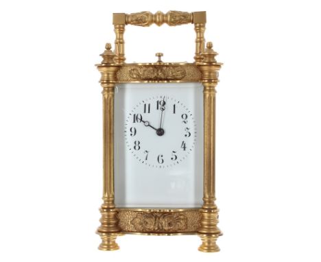 Repeater carriage clock striking the quarters on two gongs, within an ornate Doucine style case with fluted pillars and folia