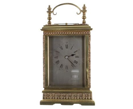 Repeater carriage clock striking on a gong, the movement back plate stamped with no. 230, the silvered dial within an ornate 