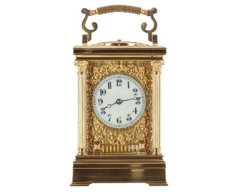 Good repeater carriage clock striking on a gong, the movement back plate stamped 1928, the 2.25" cream dial within a gilt mas