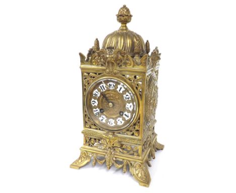 French brass two train mantel clock striking on a bell, the 3.25" dial with Arabic cartouche enamel numerals, within an ornat