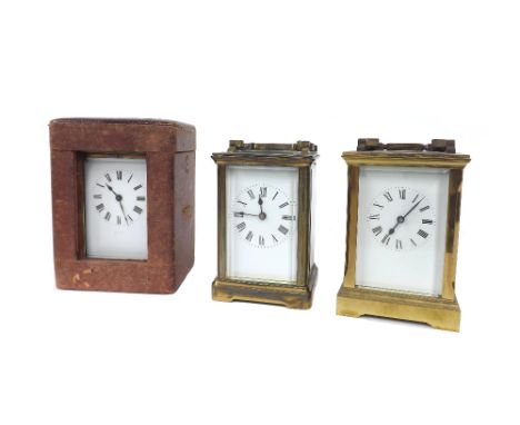Brass carriage clock timepiece, 5.75" high (key), with outer Morocco travelling case; also two other brass cased carriage tim