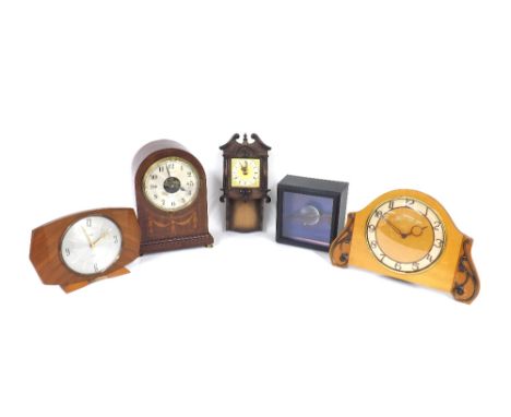Bulle electric mantel clock, the 4.5" silvered dial with skeletonised centre, within a mahogany rounded inlaid case, 9.75" hi