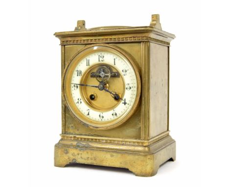 French brass two train mantel clock striking on a gong, the 3.75" cream chapter ring enclosing a recessed visible escapement,