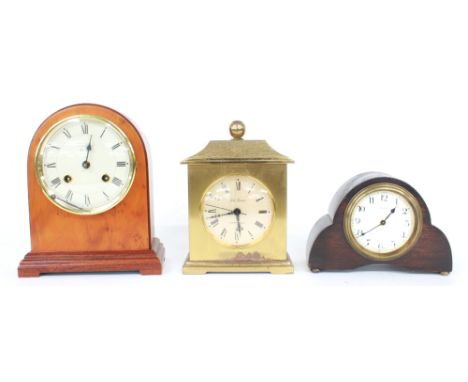 Contemporary mahogany and yew wood mantel clock striking on a bell, the 4.5" dial signed Woodford, within a rounded arched st