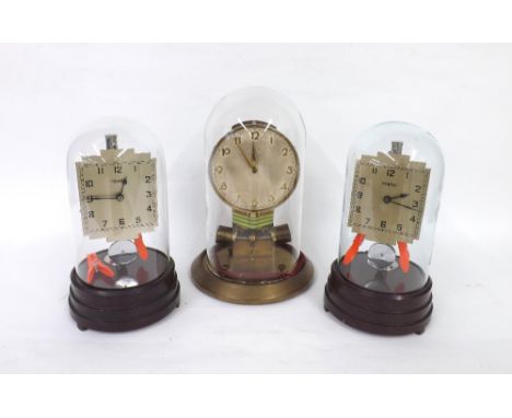 Junghans ATO Bulle-Type mantel clock, with original 1.5v battery, under a glass dome and upon a circular brass base, 12" high