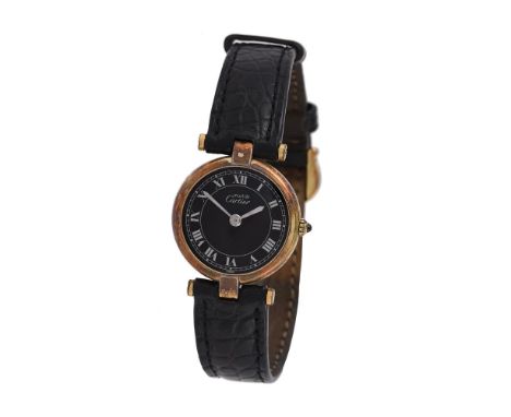 
	
		Cartier, Must de Cartier, 
		Lady's silver gilt coloured wrist watch, no. 18 03366
		Movement: Cal. 81, quartz 
		Case: 