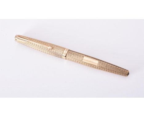 
	
		Parker, a 9 carat gold fountain pen, hallmarked London 1971, with engine turned decoration, the cap with an arrow clip, 