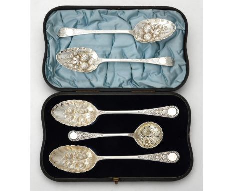 
	
		A cased pair of Victorian silver berry spoons and a sifting spoon by William Hutton &amp; Sons Ltd., London 1893, the sp