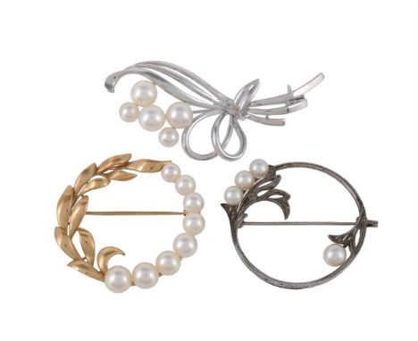 
	
		A cultured pearl brooch by Mikimoto, the hooped foliate brooch set with graduated cultured pearls, stamped K14 with Miki