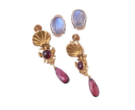 
	
		A pair of garnet earrings, the earrings with scallop shell pediments above circular cabochon garnet set shaped panels, t