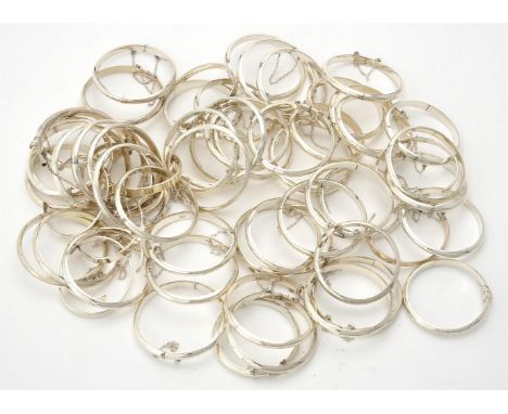
	
		A quantity of silver coloured christening bangles, mostly hinged, polished and textured designs, stamped 925, 355g (11oz
