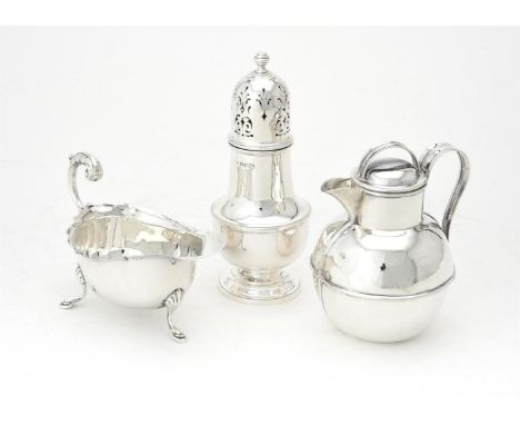 
	
		A silver Jersey cream jug by J. Collyer &amp; Co. Ltd., Birmingham 1910, with a scroll handle, 11cm (4 1/4in) high; a ca