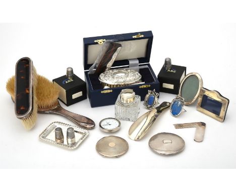 
	
		Y&nbsp;A collection of silver and silver mounted dressing table items, to include: two silver mounted and tortoiseshell 