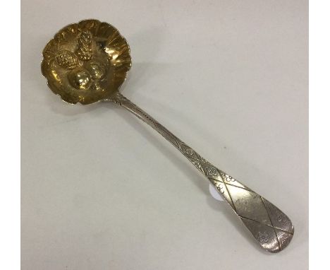 A good cast silver berry ladle engraved with flowers and leaves. London 1823. by John Hawkins. Approx. 50 grams. Est. £50 - £