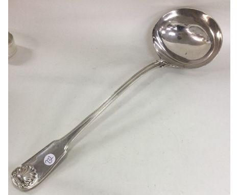 A heavy fiddle, thread and shell pattern silver soup ladle. London. By GA. Approx. 271 grams. Est. £200 - £300.