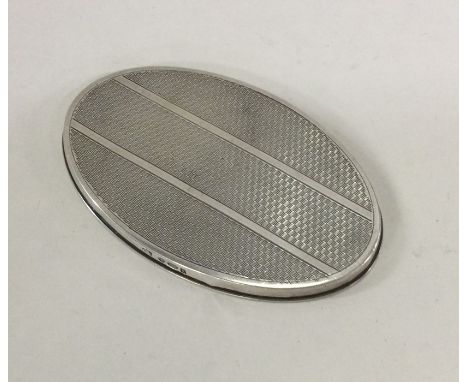 An unusual engine turned handbag mirror. London. By GS. Approx. 30 grams. Est. £20 - £30.