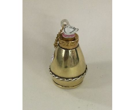 An unusual silver, gold and enamel mounted scent bottle of barrel form with swan stopper. Approx. 22 grams. Est. £250 - £350.
