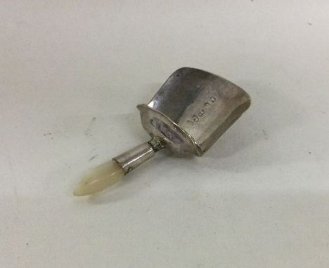 A silver and MOP caddy scoop. Birmingham. By Samuel Pemberton. Approx. 9 grams. Est. £40 - £60.