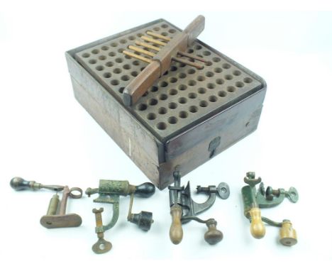 An Erskine patent reloading box, together with four various roll turnover tools. (5)