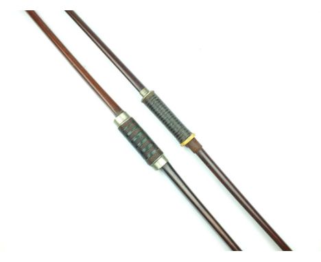Two Victorian or Edwardian longbows, the first 195.5cm in length with horn terminals and white metal mounted cord and leather