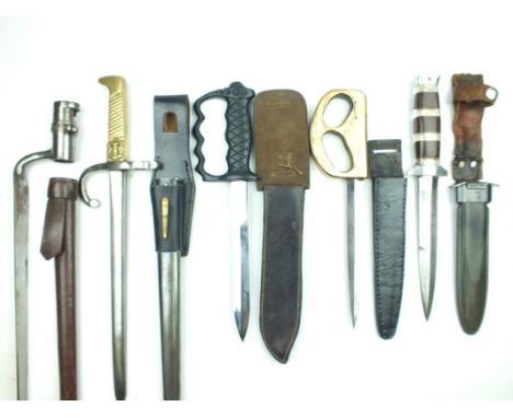 A field produced knuckleduster knife, 17.5cm flattened diamond section blade, patinated, heavy brass D-shaped hilt stamped 19