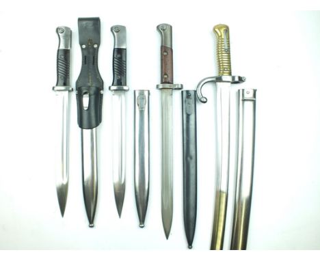 A Third Reich Mauser 1884/98 bayonet, by COPPEL GMBH, stamped 38 on the back edge, contained in its steel scabbard complete w