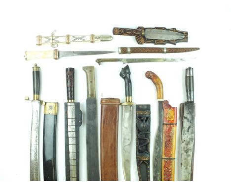 A small collection of machete, a mixture of origins, to include Malaya and Africa. (9) 