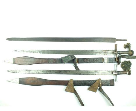 A Sudanese Kaskara, 88.5cm broad fullered blade, characteristic iron hilt with spatulate cruciform cross guard, leather bound