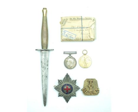 A Second Pattern Fairbairn-Sykes Fighting Knife, 15cm flattened diamond section blade with chequered brass hilt, tip rounded,