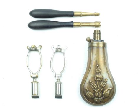 A small collection of accessories, to include an embossed copper powder flask decorated with flowers, two plated brass 12bore