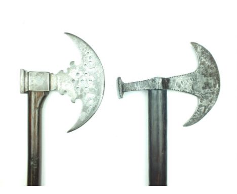 Two Sixteenth Century European axes, the first with 18cm diameter head with notched neck, the balance in the form of a square