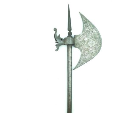 An Indian Axe, 24cm diameter head decorated over all with scrolling foliage and birds with silver damascene highlights, the f