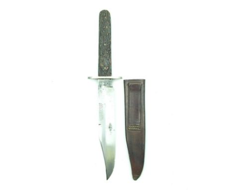 A 19th Century IXL Bowie knife by Wostenholm & Son, 15cm clipped back blade, riveted two-piece natural horn grips, contained 