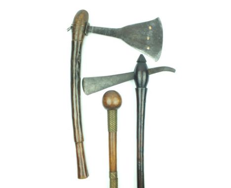 A group of African tribal weapons, comprising two axes, probably Congo, the first with broad head incised with geometric desi