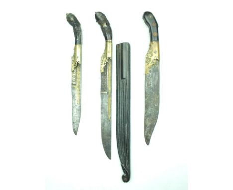 Three various Sinhalese Piha-Kaetta, the first with 24.5cm blade, the deep fuller lined with brass decorated with scrolling f