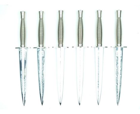 A bespoke set of six commemorative Third Pattern Fairbairn-Sykes Fighting Knives, created by John Arlett, each with 17.5cm fl