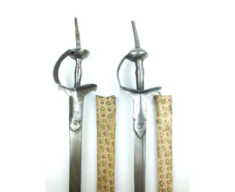 A brace of Indian Firangi, the first with 95.5cm fullered blade with slightly rounded tip, characteristic steel hilt with elo